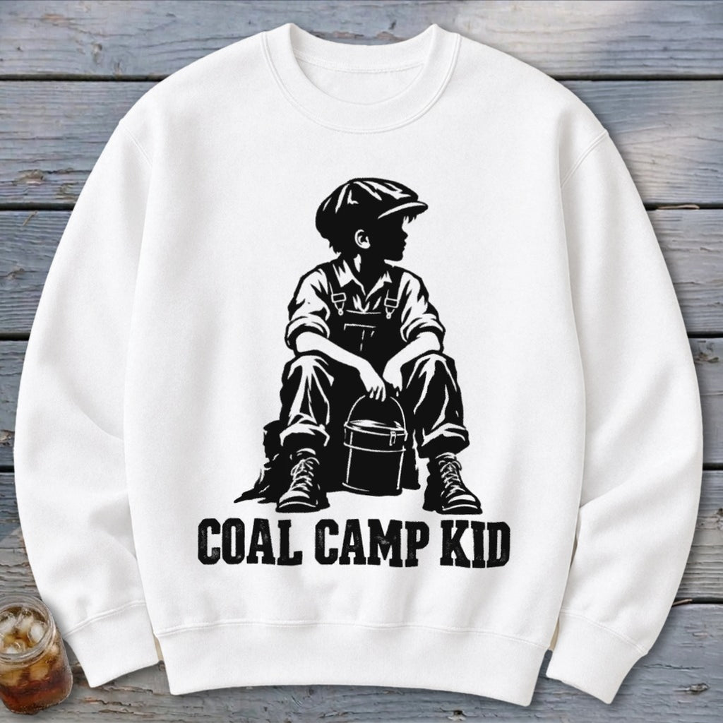 White sweatshirt with black graphic of a boy in overalls and cap holding a bucket, text reads "COAL CAMP KID".