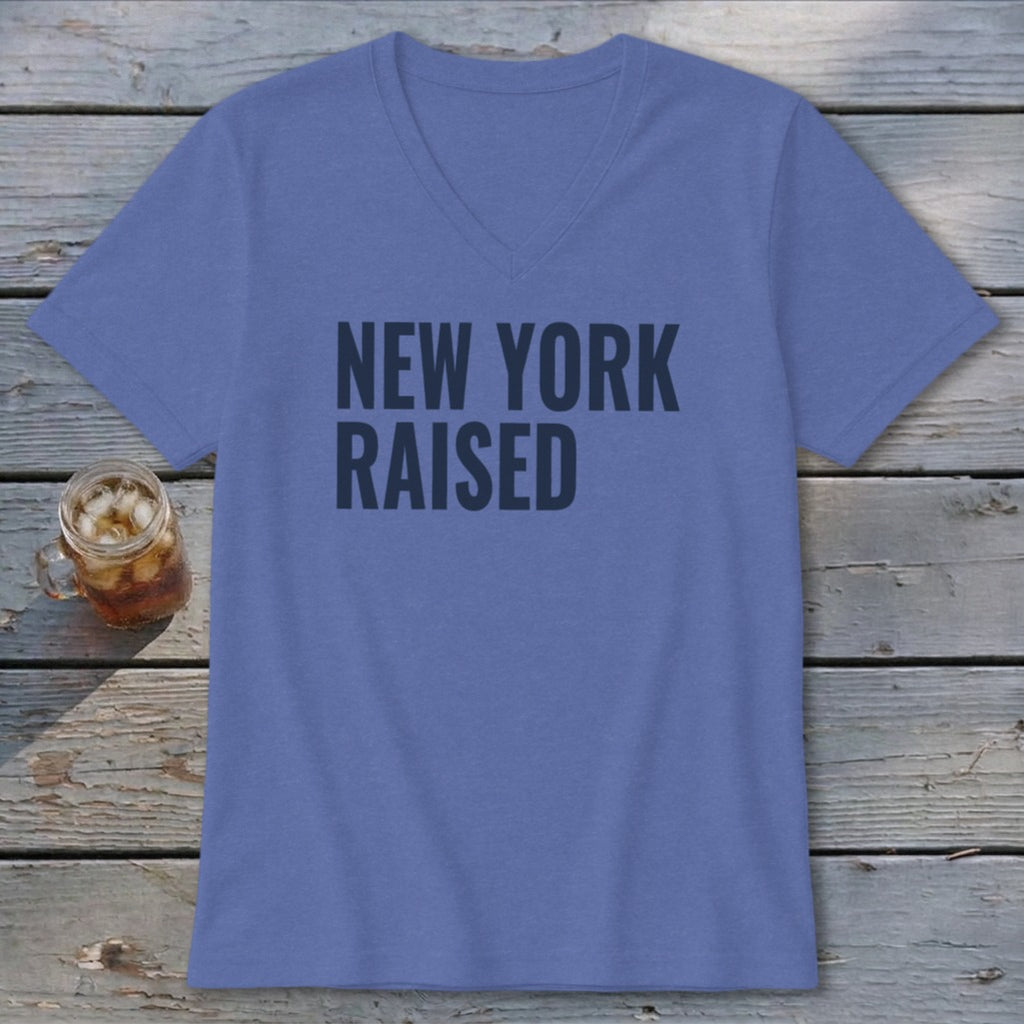 Blue v-neck t-shirt with "NEW YORK RAISED" text in dark gray.