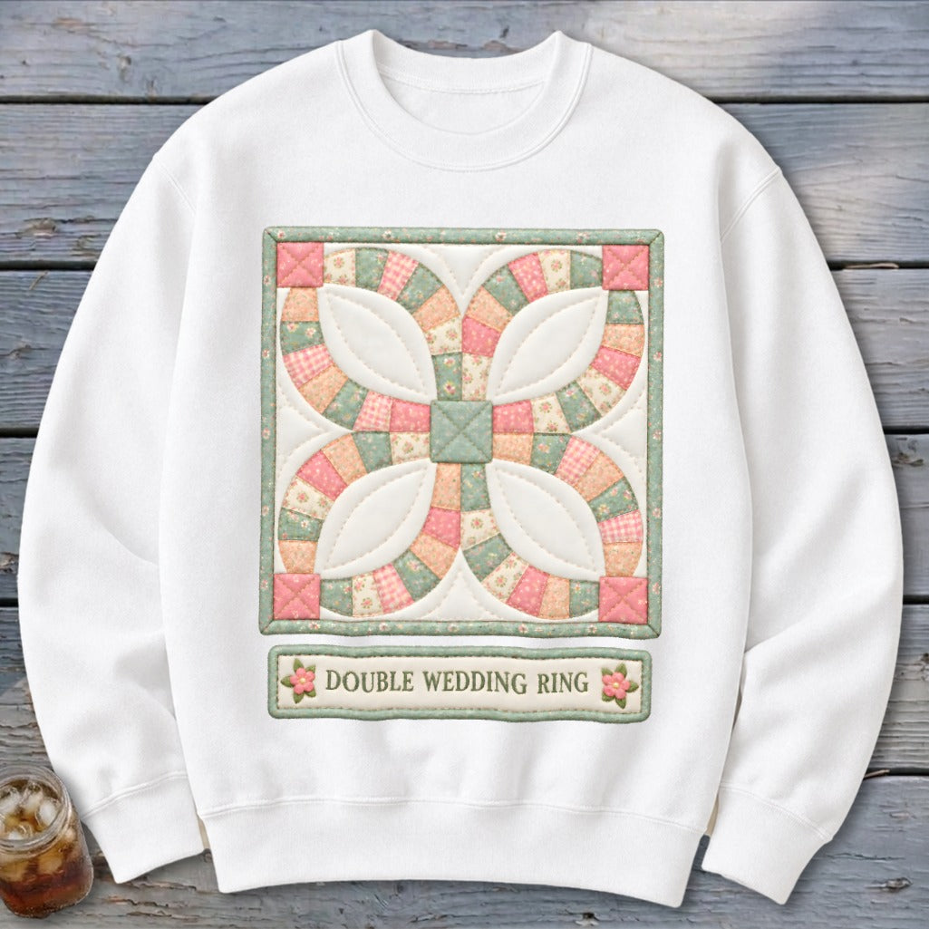 White sweatshirt with double wedding ring quilt block graphic and text.