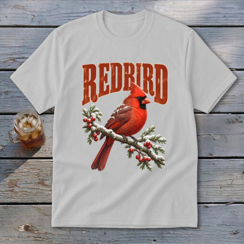 A grey crewneck t-shirt featuring a red cardinal on a snowy branch with the text REDBIRD.