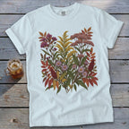 White t-shirt with a large floral print featuring autumn foliage and flowers.