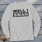 Light gray long-sleeve t-shirt with the black text WELL I SWAN printed across the chest.