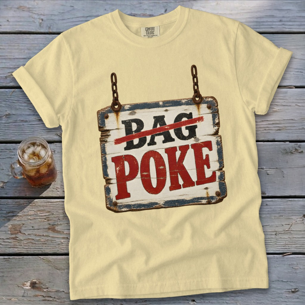 A light yellow t-shirt with a graphic of a rustic wooden sign reading Bag Poke.