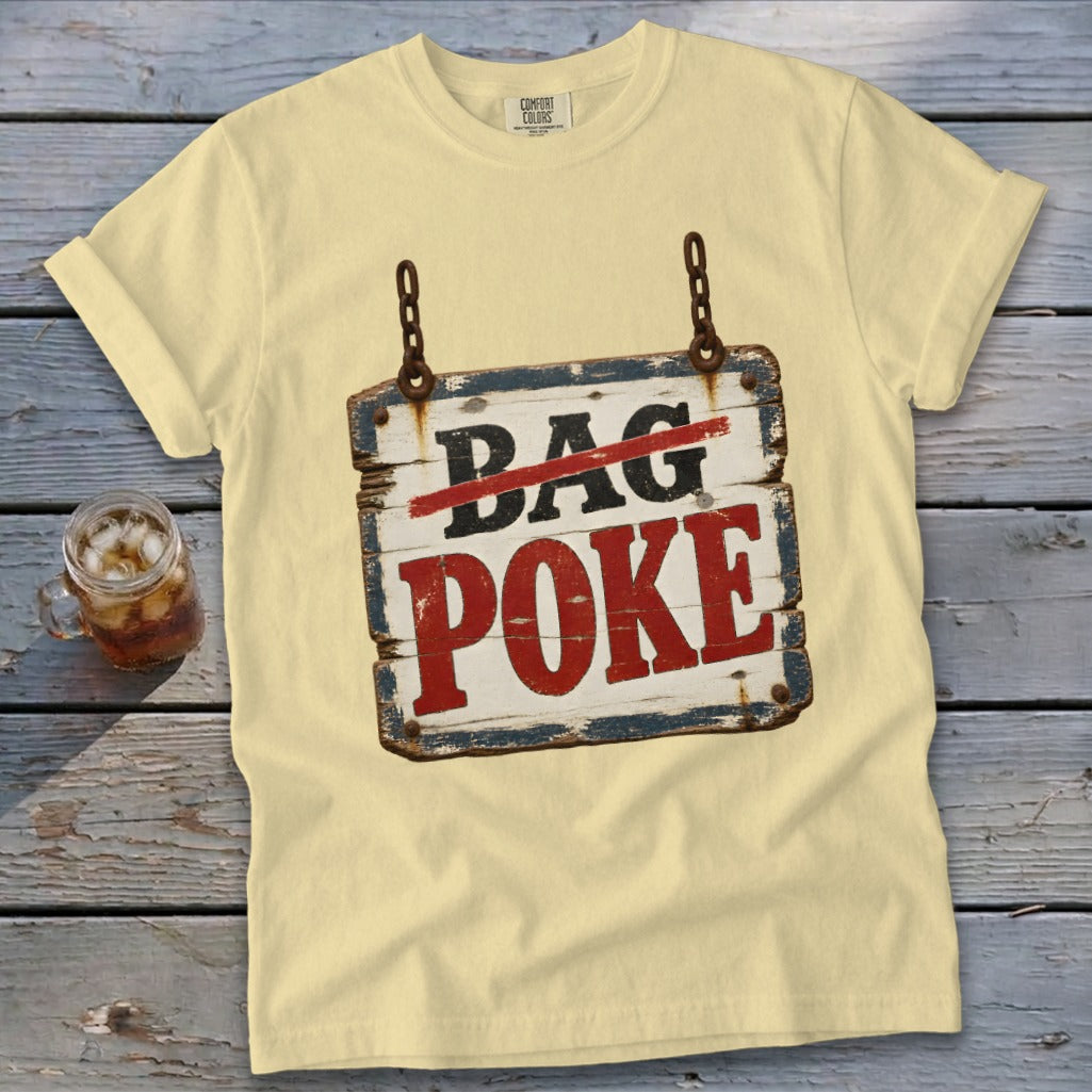 A light yellow t-shirt with a graphic of a rustic wooden sign reading Bag Poke.