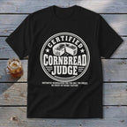 A black t-shirt features a circular white graphic with the text "Certified Cornbread Judge."