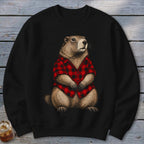 Groundhog wearing a red and black buffalo plaid shirt on a black sweatshirt.