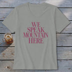 Gray v-neck t-shirt with pink text that reads "WE SPEAK MOUNTAIN HERE".