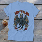 Light blue t-shirt with Mothman graphic saying "Mothman Was My Neighbor".