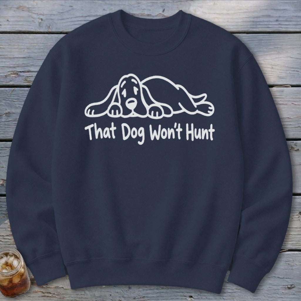 Navy blue crewneck sweatshirt featuring a white graphic of a sleeping basset hound and the text That Dog Won't Hunt.