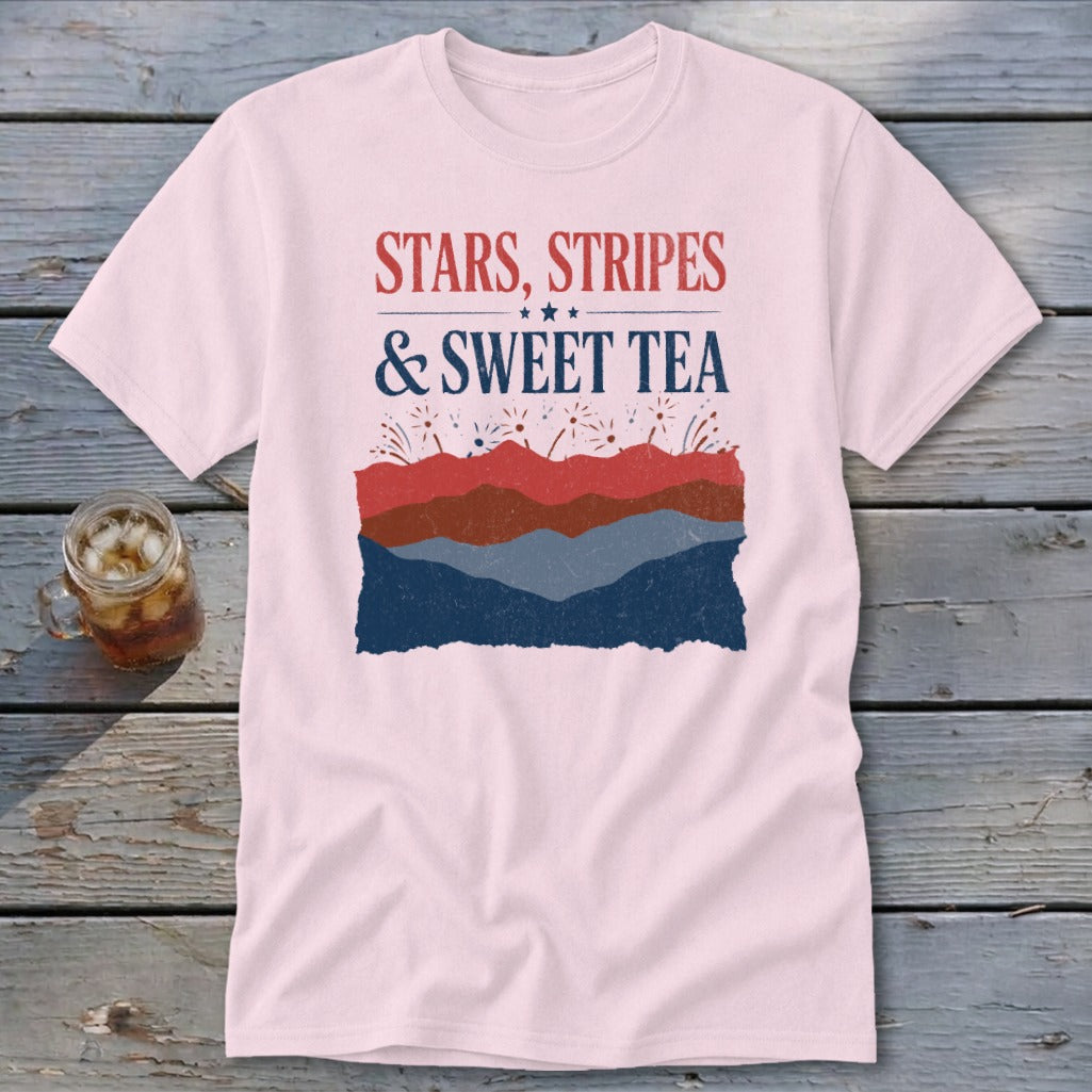 A light pink t-shirt with patriotic graphics featuring the text Stars, Stripes and Sweet Tea.