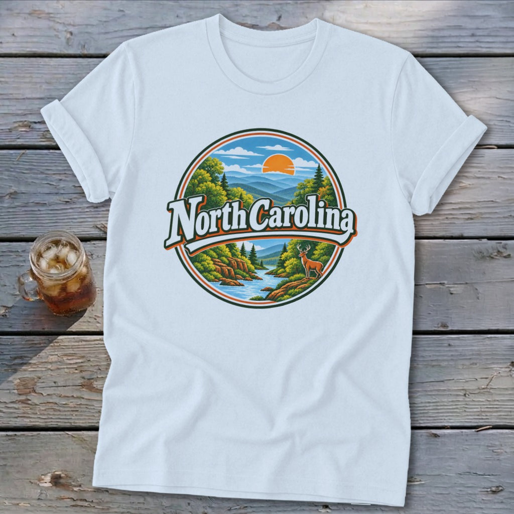 White t-shirt with a circular graphic of a mountain landscape with "North Carolina" text.
