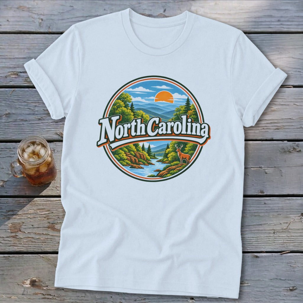White t-shirt with a circular graphic of a mountain landscape with "North Carolina" text.