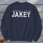 Navy crewneck sweatshirt with "LOOKING A LITTLE JAKEY" text in white.