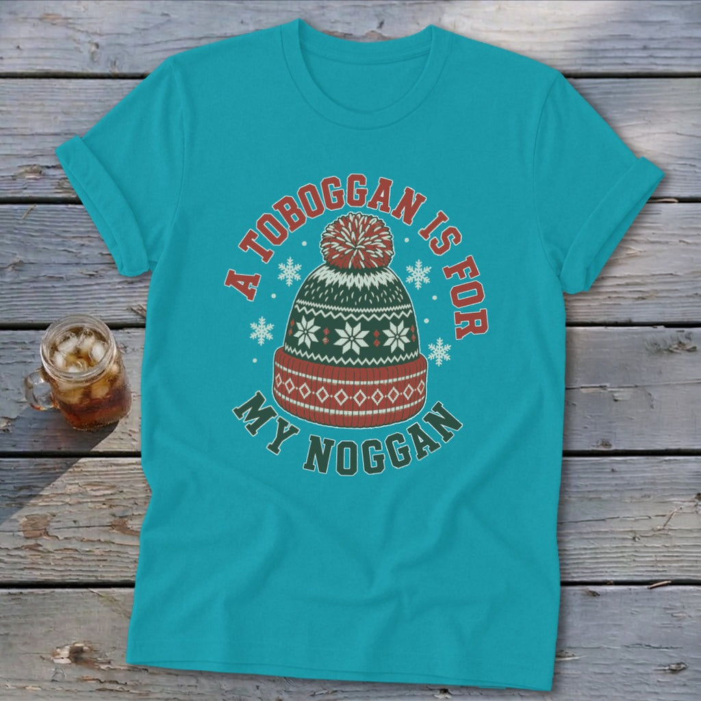 Turquoise t-shirt featuring a graphic of a winter toboggan hat with the text A toboggan is for my noggan.