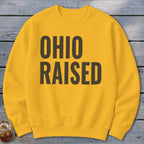 Yellow sweatshirt with "OHIO RAISED" in dark text.