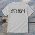 White t-shirt with black text reading "JUST A MESSIN AND A GOMMIN".