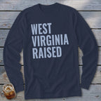 Navy long-sleeve shirt with light blue text reading "WEST VIRGINIA RAISED".