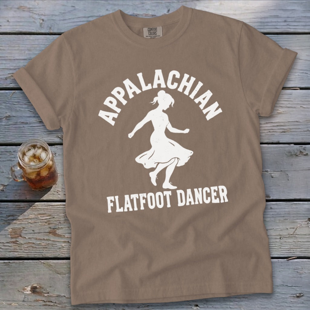 Brown t-shirt featuring a white graphic of a dancer with Appalachian Flatfoot Dancer text.