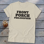 Cream t-shirt with "FRONT PORCH PHILOSOPHER" text in black, next to a glass of iced tea.