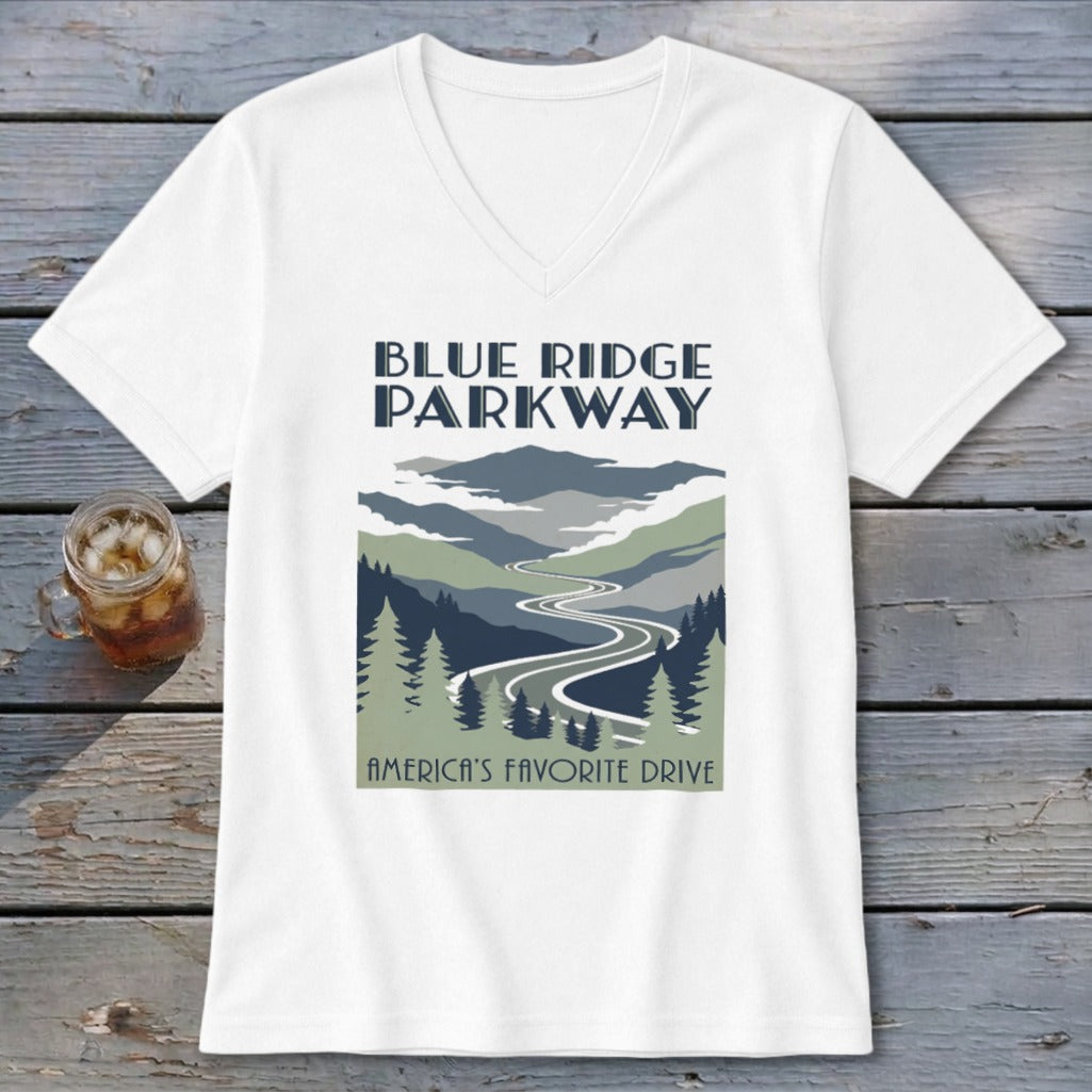 A white V-neck t-shirt featuring a Blue Ridge Parkway graphic print with a winding road through mountains.