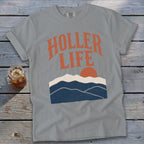 Gray t-shirt with "Holler Life" text and mountain sunset graphic.