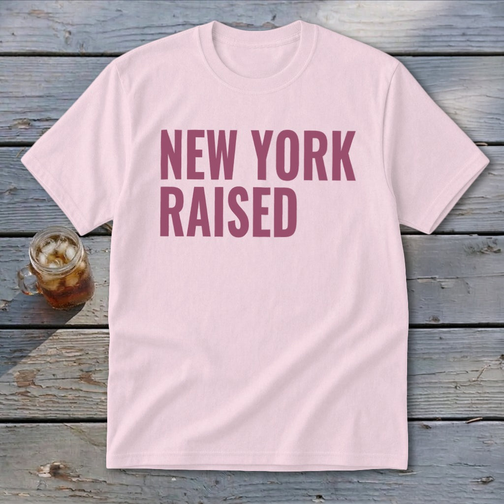 Pink t-shirt with "NEW YORK RAISED" text in dark pink lettering.