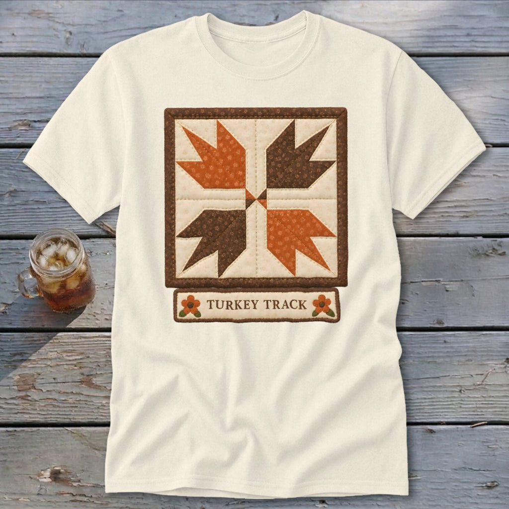 Cream t-shirt with quilt square design and "TURKEY TRACK" text.