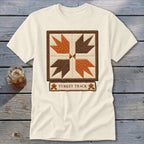 Cream t-shirt with quilt square design and "TURKEY TRACK" text.