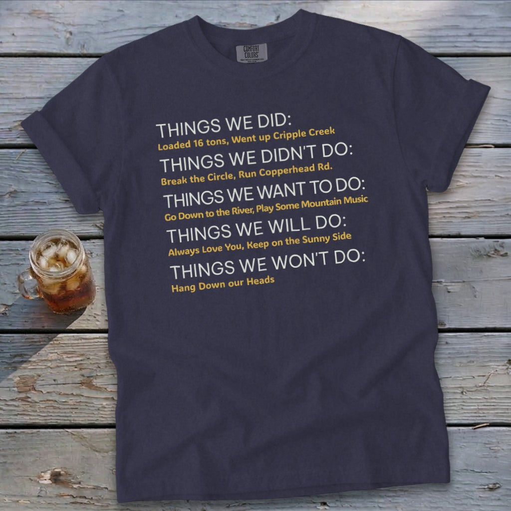 Navy t-shirt with white and yellow text listing "Things We Did", "Didn't Do", "Want To Do", "Will Do", "Won't Do".
