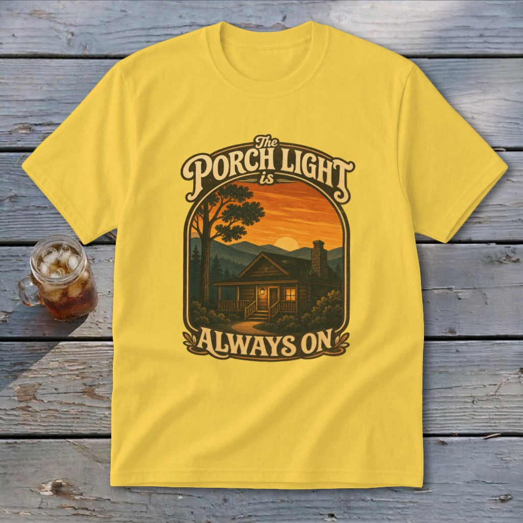Yellow t-shirt with "The Porch Light Is Always On" text and cabin scene.