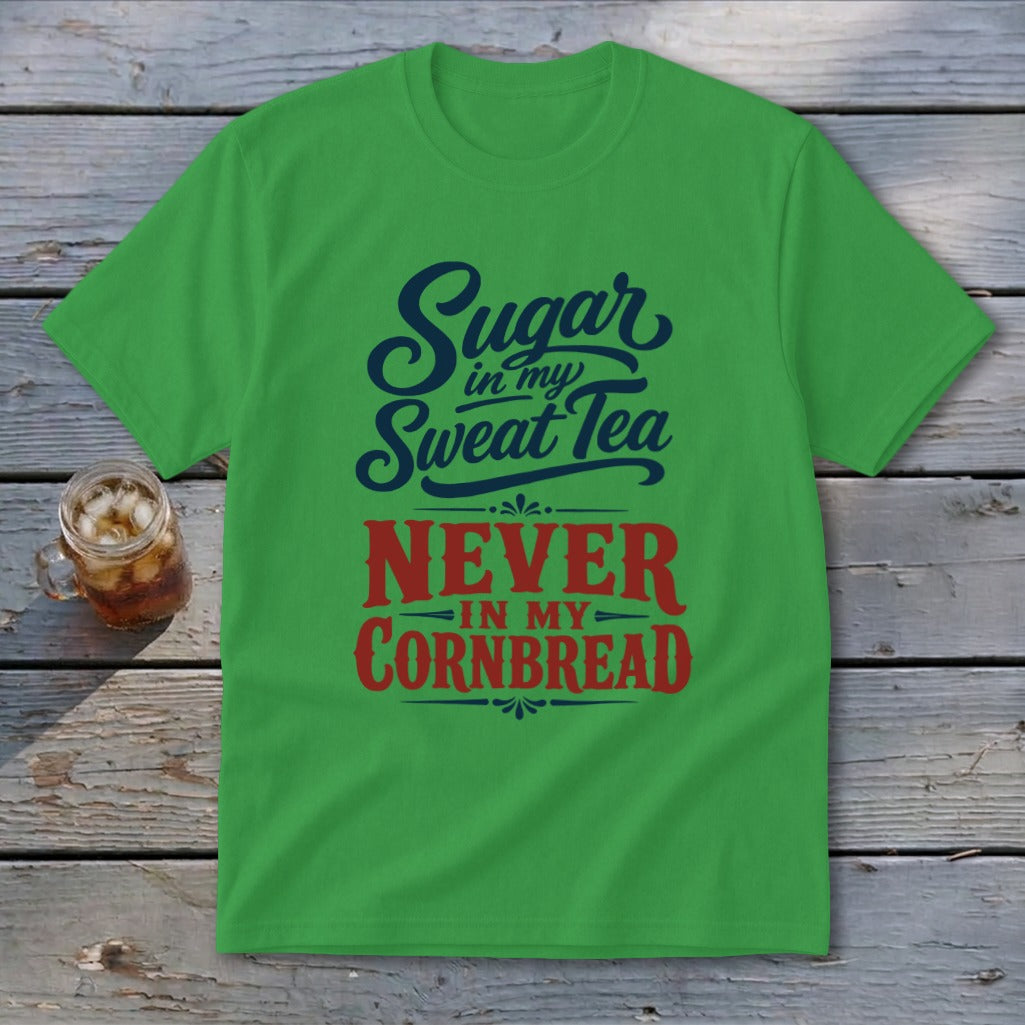 A green short-sleeve t-shirt with blue and red text stating Sugar in my Sweat Tea NEVER IN MY CORNBREAD.