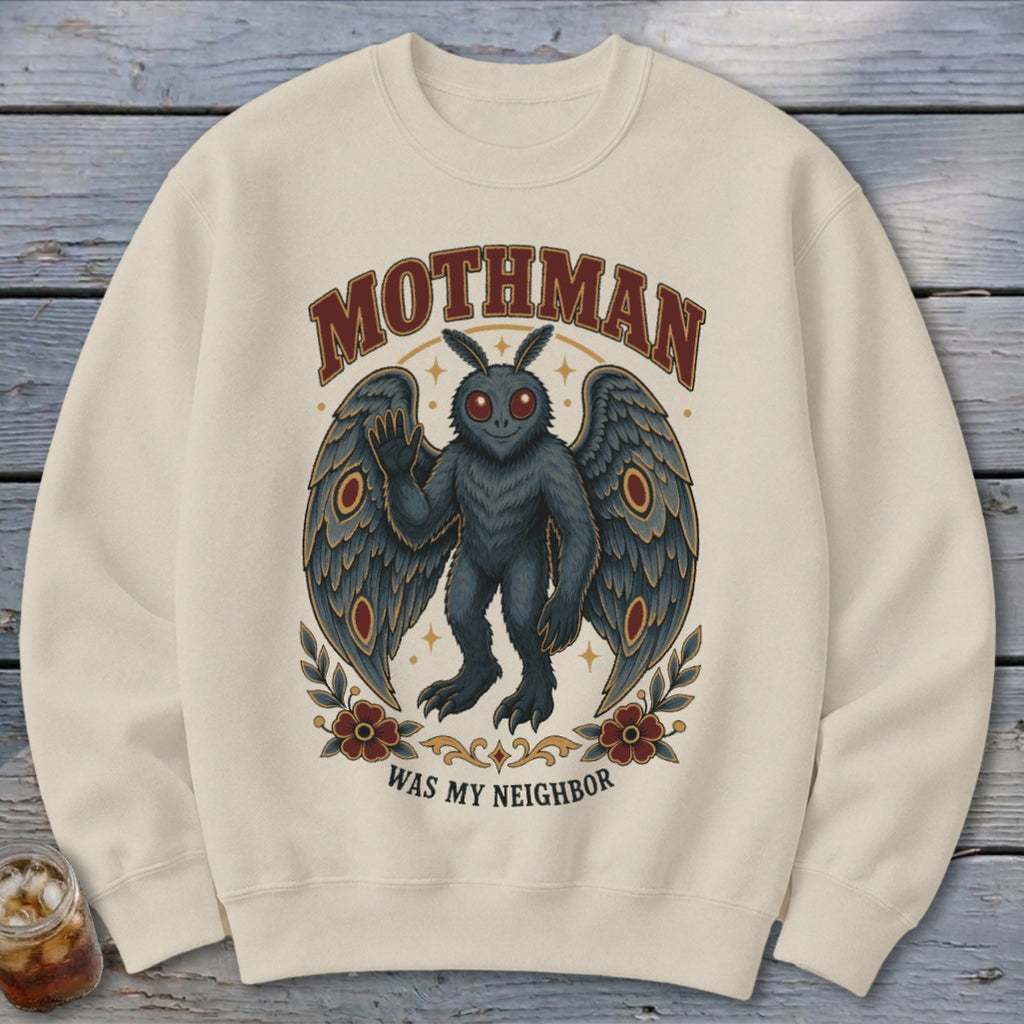 Cream sweatshirt with Mothman graphic, saying "MOTHMAN WAS MY NEIGHBOR".