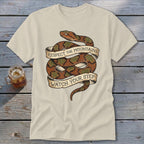 Cream t-shirt with coiled snake graphic and text: "Respect the Mountains, Watch Your Step."