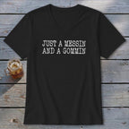 Black v-neck t-shirt with "JUST A MESSIN AND A GOMMIN" printed in white.