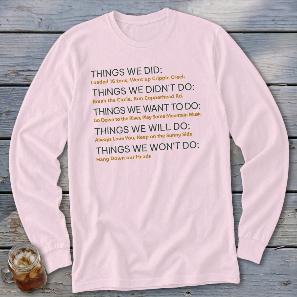 Pink long-sleeve shirt with list of "Things We Did" and other sayings printed in gray and orange text.