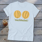 Light blue t-shirt with two cantaloupes and text "mushmelons".