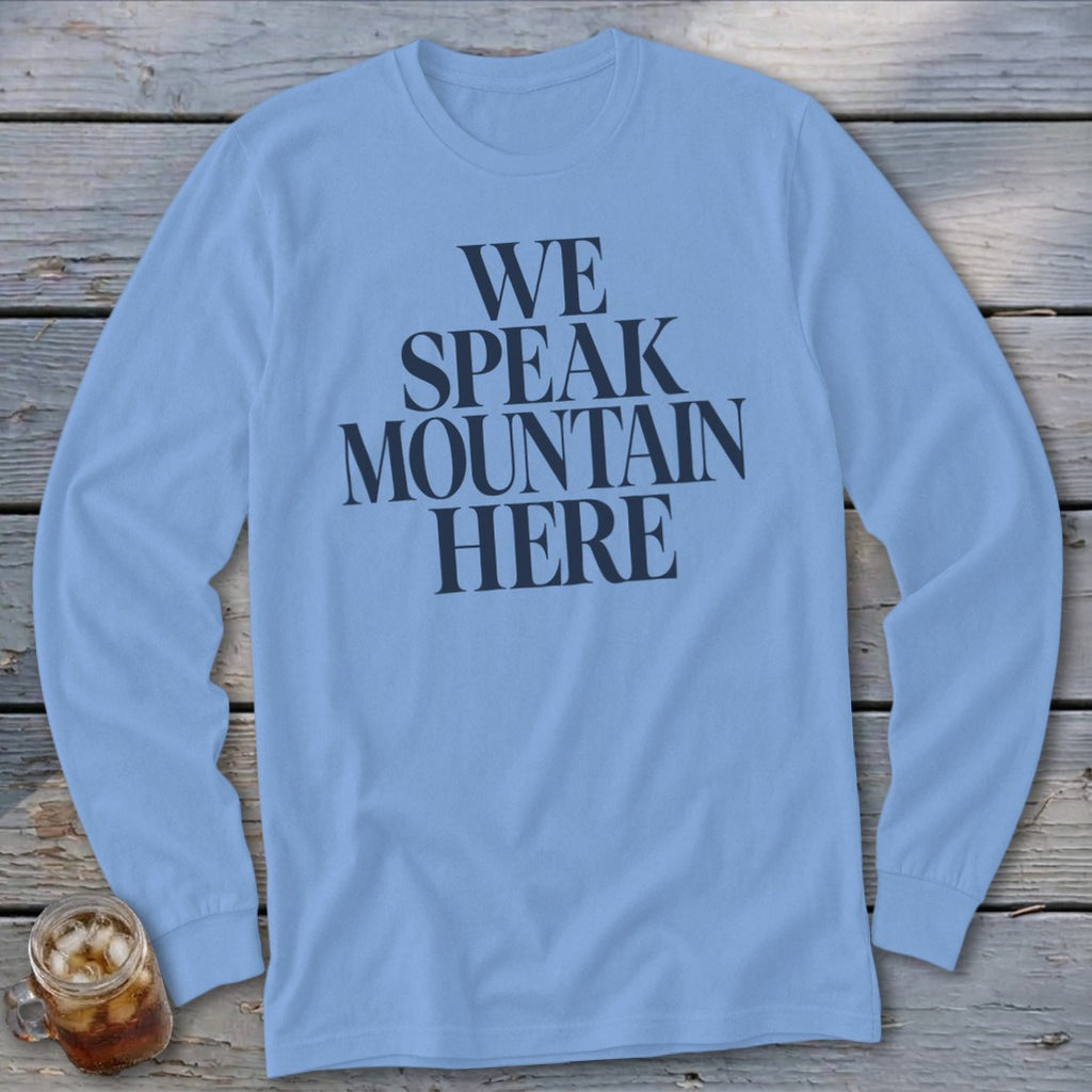 Light blue long-sleeve shirt with "WE SPEAK MOUNTAIN HERE" text.