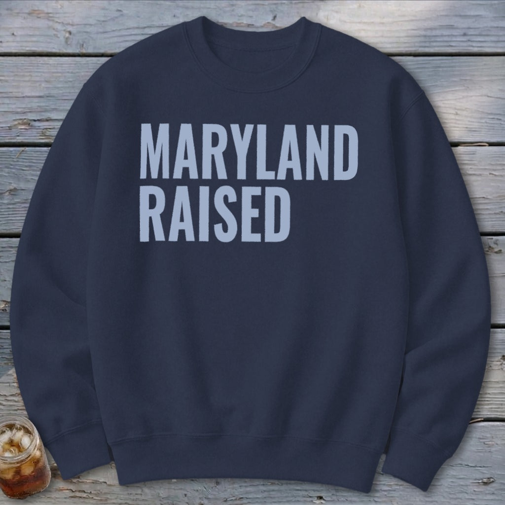 Navy blue sweatshirt with light blue text reading "Maryland Raised".