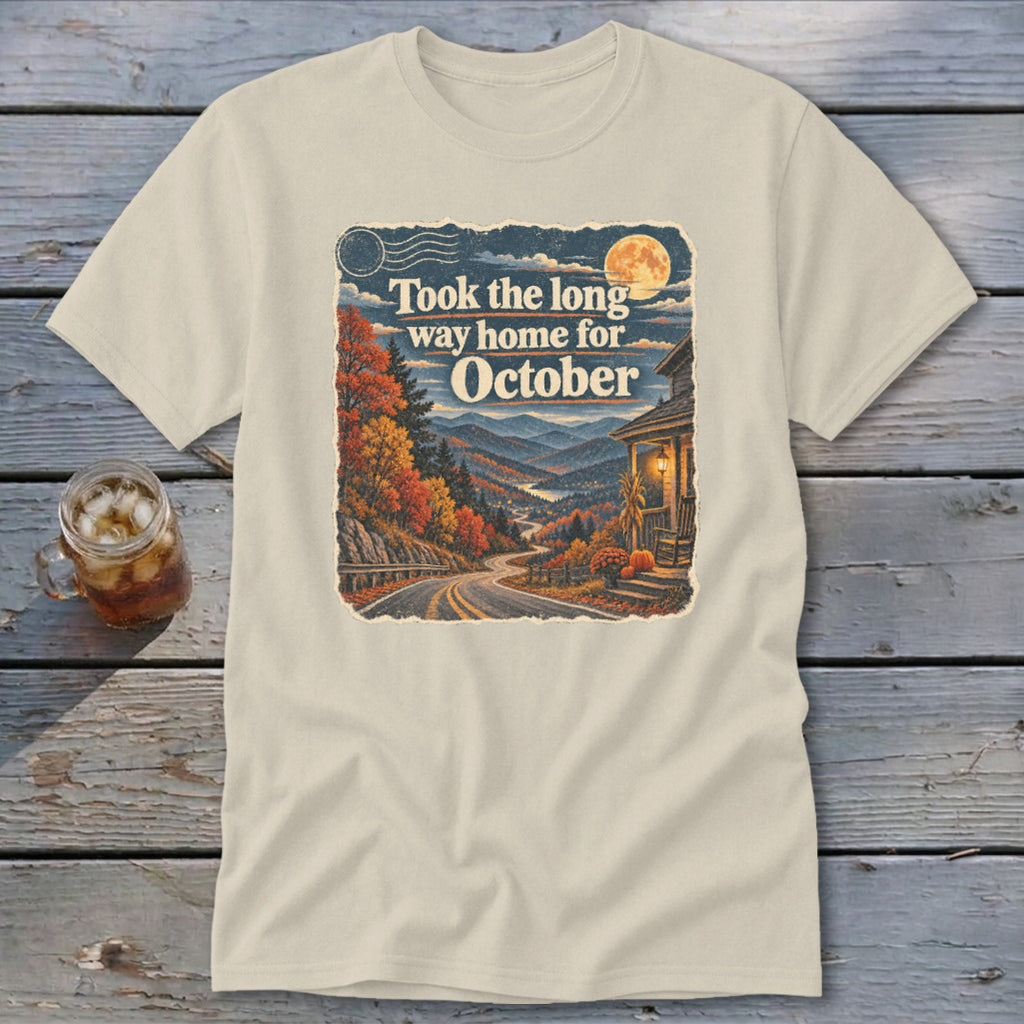 Cream t-shirt with "Took the long way home for October" text and autumn mountain landscape.