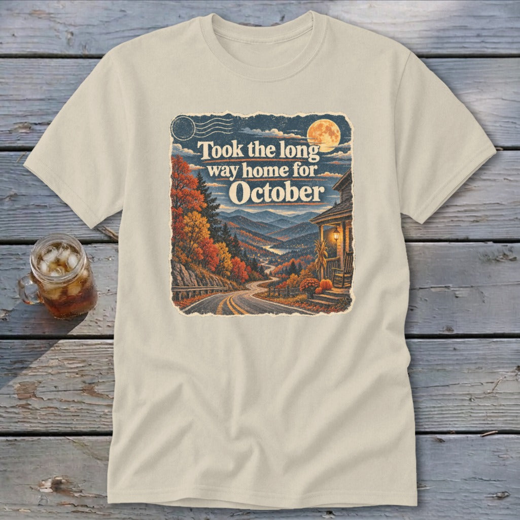 Cream t-shirt with "Took the long way home for October" text and autumn mountain landscape.