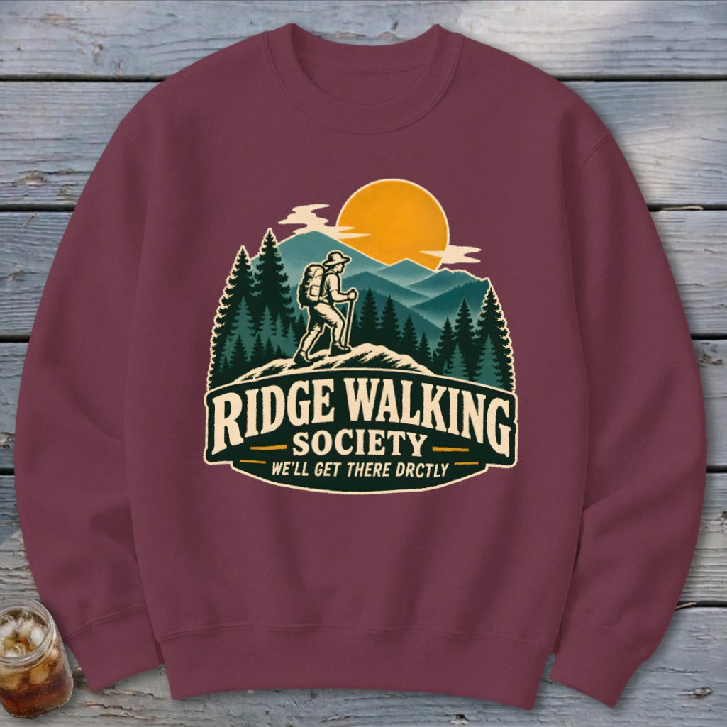 Burgundy sweatshirt with "Ridge Walking Society" graphic depicting a hiker.