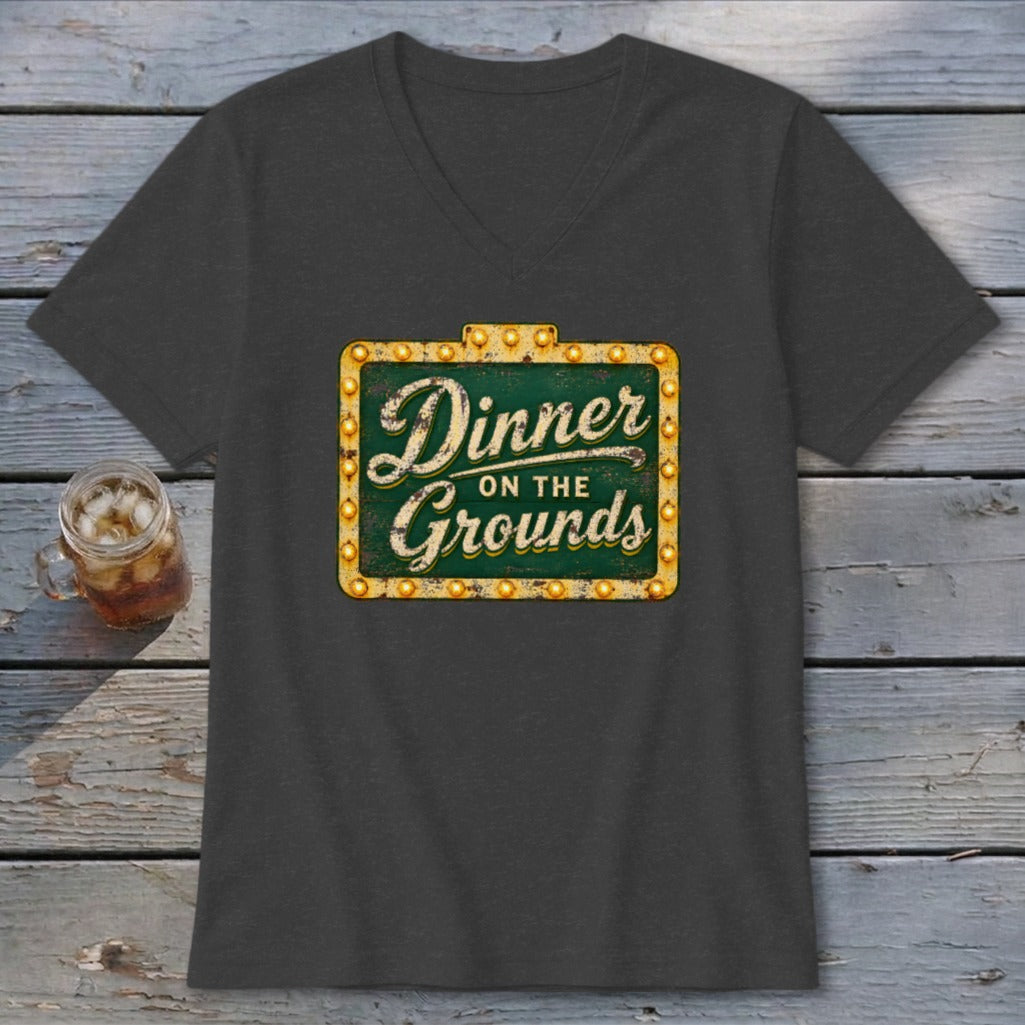 Dark grey V-neck t-shirt featuring a vintage lighted sign graphic with the text Dinner on the Grounds.