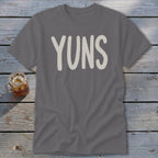 Gray t-shirt with white "YUNS" text and a glass of iced tea.