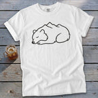 White t-shirt with sleeping bear and mountain graphic.