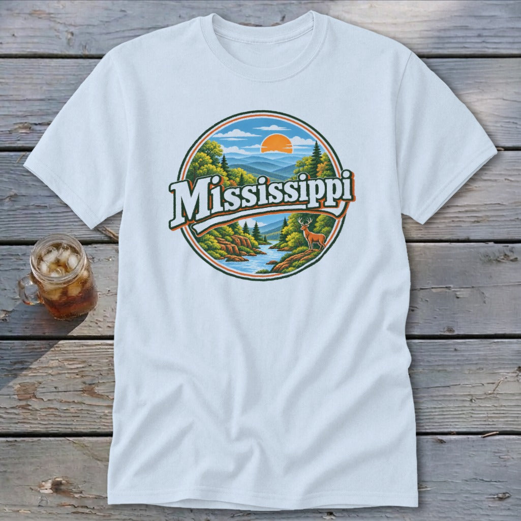 White t-shirt with circular graphic depicting a river, trees, mountains, and a deer, with "Mississippi" text.