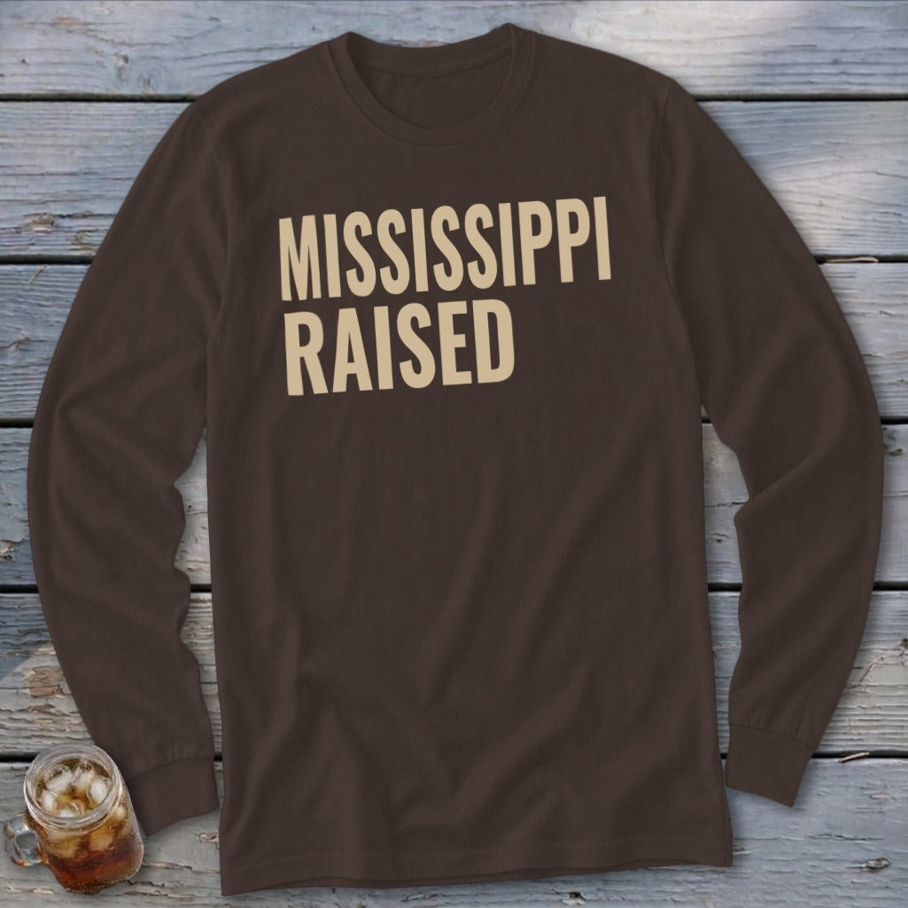 Brown long sleeve shirt with "MISSISSIPPI RAISED" in tan text.