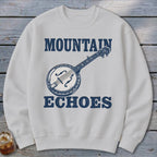 Off-white crewneck sweatshirt featuring a blue graphic of a banjo and the text Mountain Echoes.
