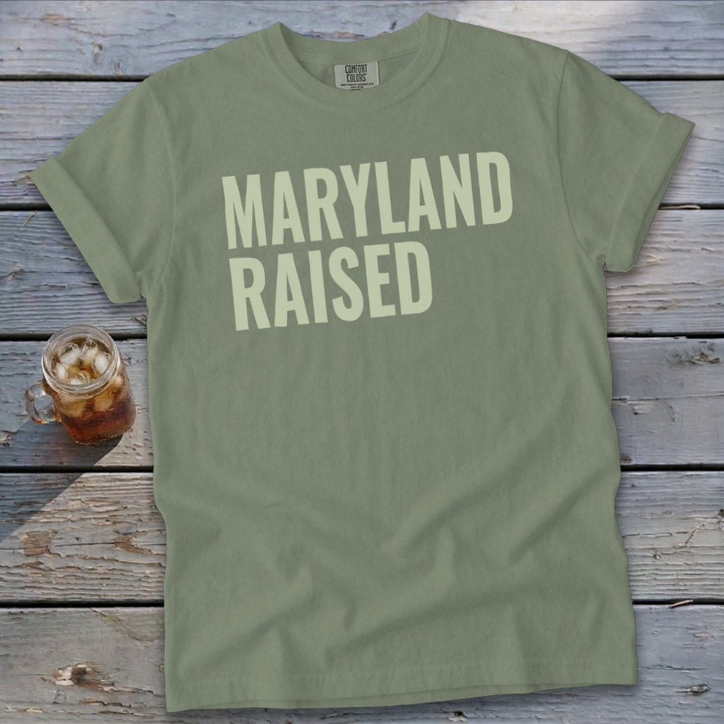 Olive green t-shirt with "MARYLAND RAISED" text in light green.