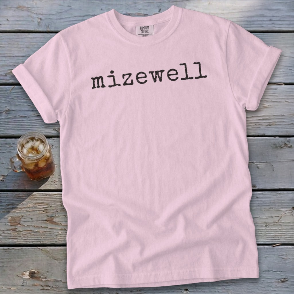 Pink t-shirt with black "mizewell" text and Comfort Colors label.