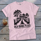 Pink t-shirt with black graphic of a farmhouse and "OLD HOME PLACE" text.